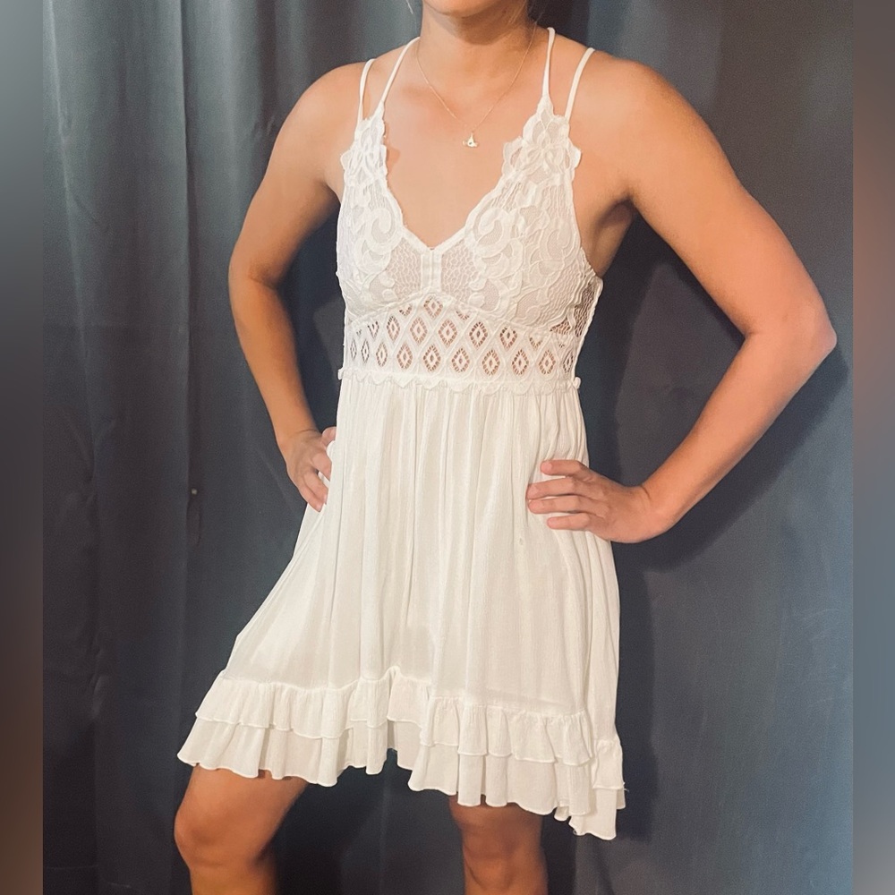White spaghetti strap, lace upper bodice dress.